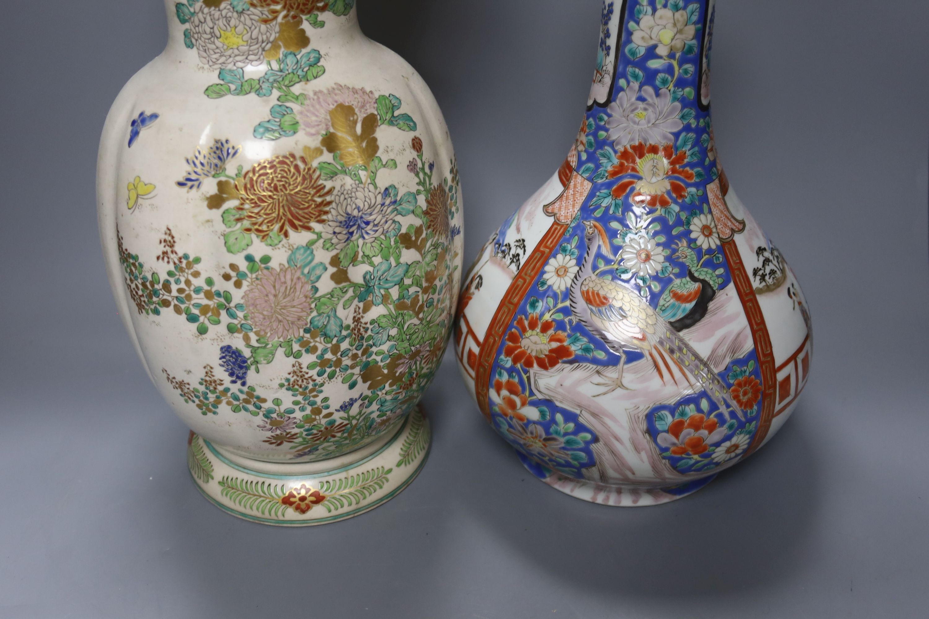 A Japanese porcelain bottle vase and a large Satsuma pottery vase (restoration) 39cm (2)
